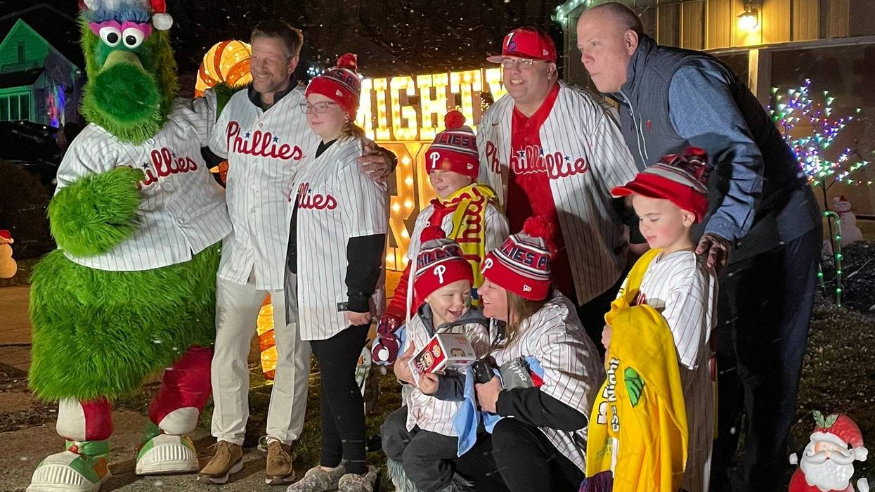 Aaron Kline and his family gather for a picture with the Philly Phanatic and Phillies TV voice Tom McCarthy, on a special night for the 4-year-old boy from Mount Laurel who is battling a recently-removed brain tumor.