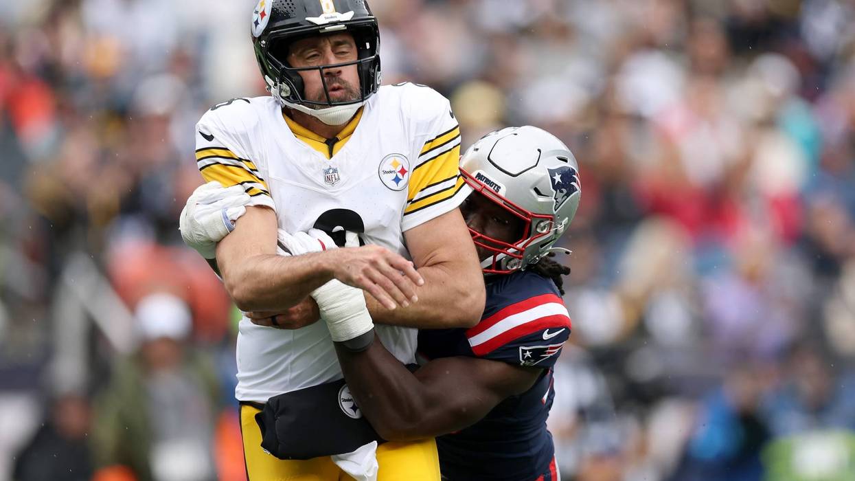 Aaron Rodgers #8 of the Pittsburgh Steelers is tackled by Gabe Jacas #50 of the New England Patriots during the first quarter of the game at Gillette Stadium on September 20, 2026 in Foxborough, Massachusetts.