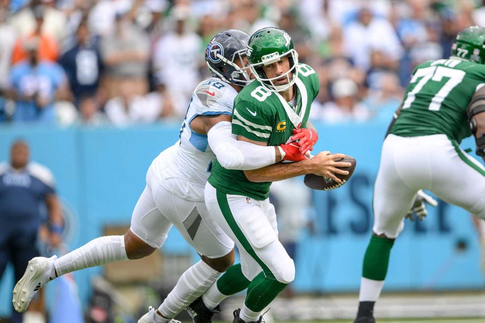 Aaron Rodgers and Kenneth Murray Jr.
