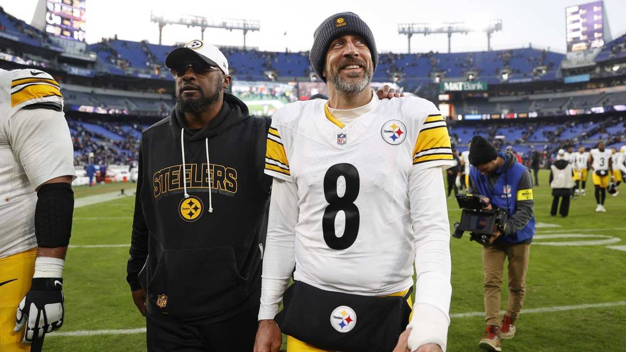 Aaron Rodgers with Mike Tomlin walking off the field
