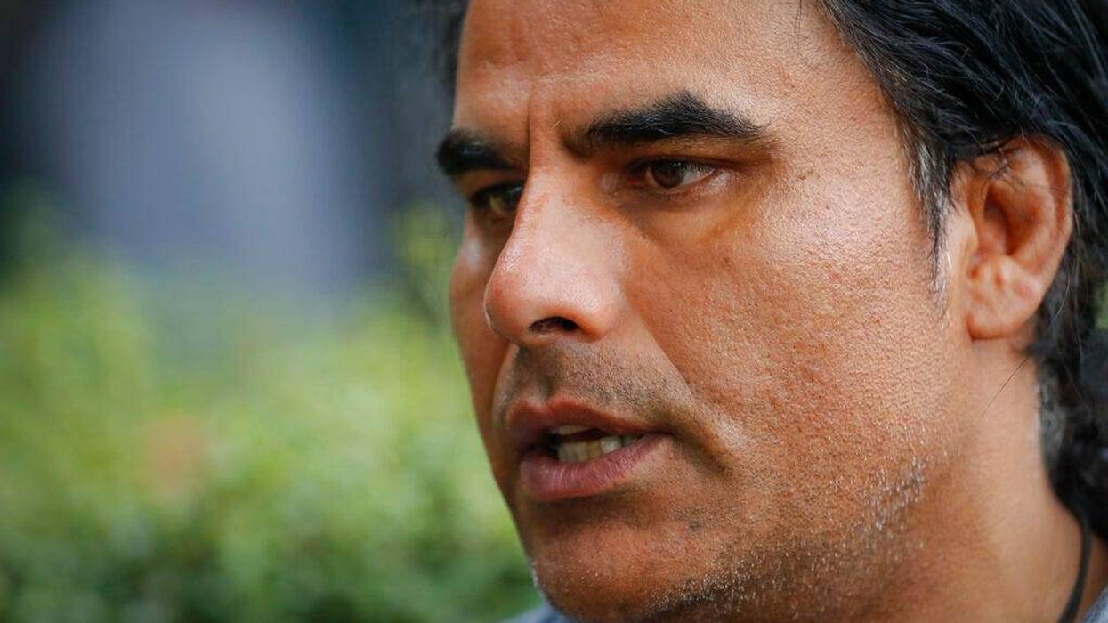 Abdul Aziz, survivor of mosque shooting speaks to Associated Press during an interview in Christchurch, New Zealand, Saturday, March 16, 2019.
