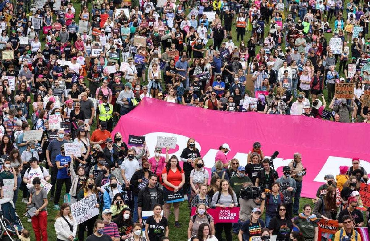 Abortion rights activists participate in a Bans Off Our Bodies rally at the base of the Washington Monument on May 14, 2022 in Washington, DC. Abortion rights supporters are holding rallies around the country urging lawmakers to affirm abortion rights into law after a leaked draft from the U.S. Supreme Court exposed a potential decision to overturn Roe v. Wade.