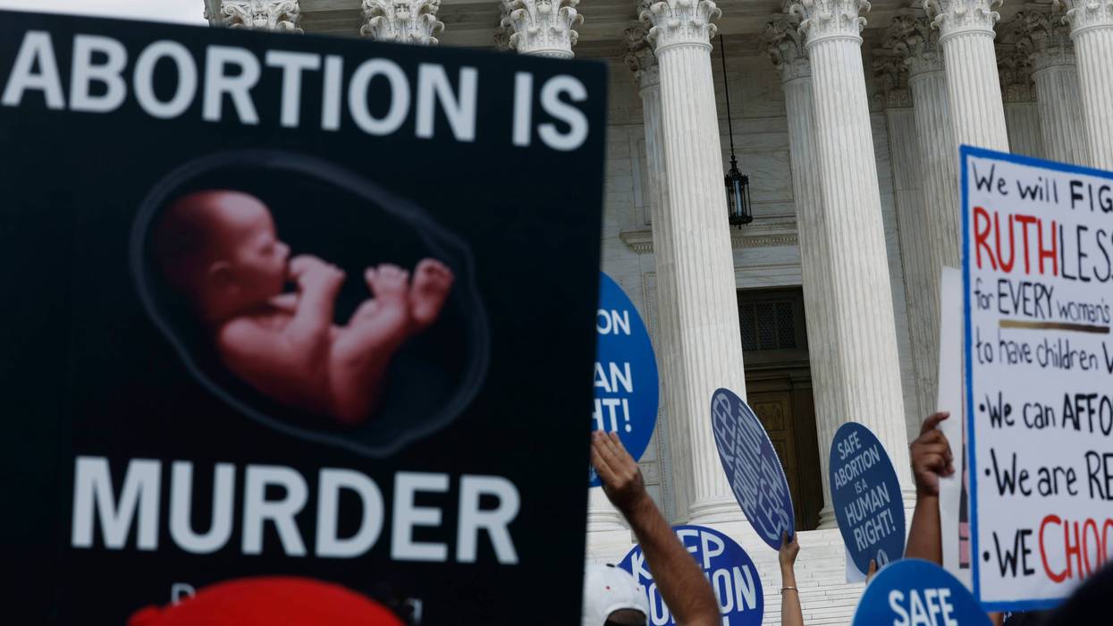Abortion rights and anti-abortion rights activists participate in a protest outside of the U.S. Supreme Court building on June 24, 2024, in Washington, D.C.