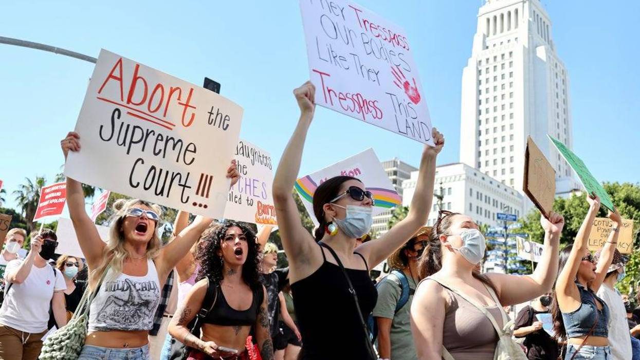 Abortion rights supporters march past City Hall while protesting against the recent U.S. Supreme Court decision to end federal abortion rights protections on June 27, 2022 in Los Angeles, California.