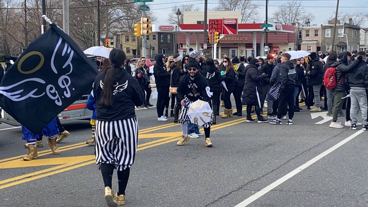 About 50 people marched on Jan. 1, 2021, in honor of George Piccoli, a friend who died of COVID-19 in August.