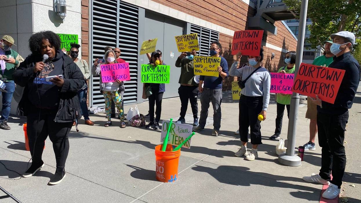 About a dozen members of Oakland community groups rallied outside the Athletics’ Jack London Square offices on Wednesday, calling on the team to include more community benefits in their Howard Terminal project proposal.