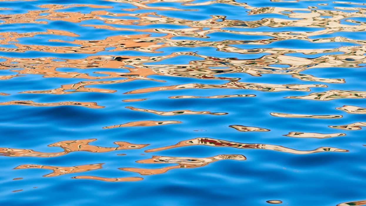 Abstract background created with a closeup of the waves of a lake