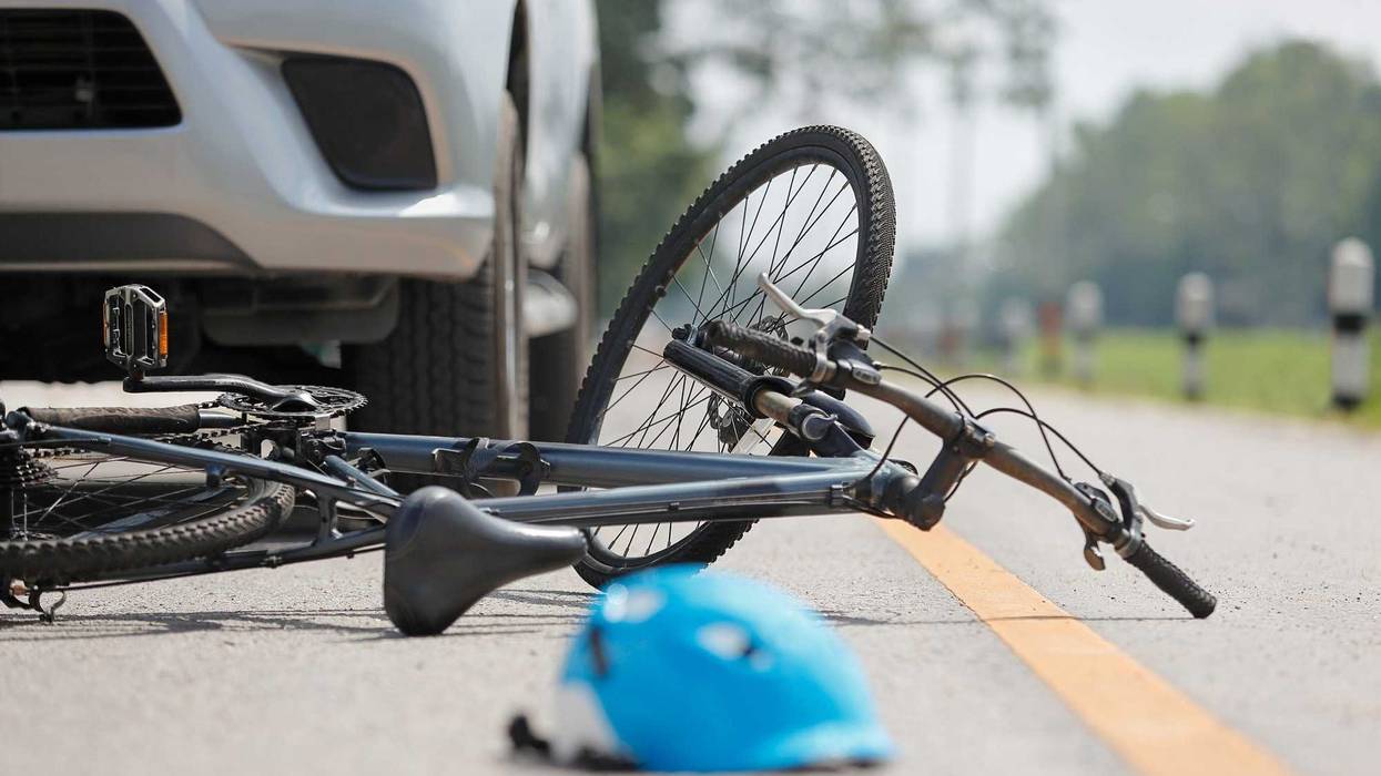 Accident car crash with bicycle on road