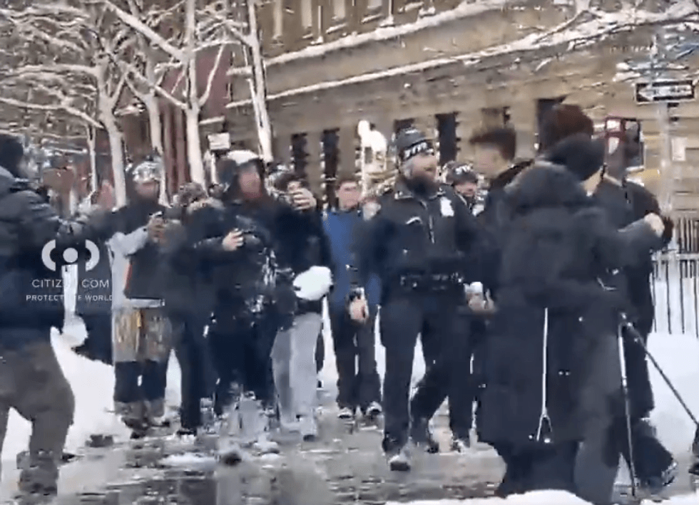 According to cops, they "intentionally struck the police officers multiple times with snow and ice in the head, neck, and face" around 4:20 p.m. Monday as a planned snowball fight was taking place