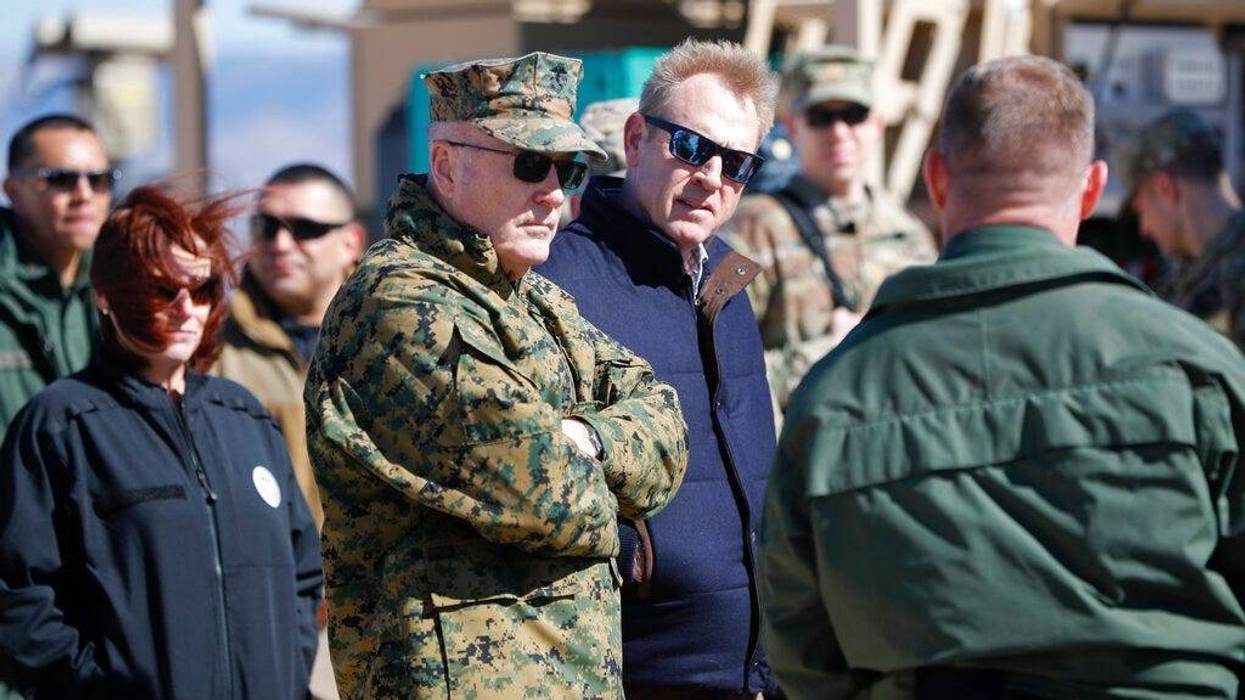 Acting Secretary of Defense Patrick Shanahan, center, and Joint Chiefs Chairman Gen. Joseph Dunford, left, tour the US-Mexico border at Santa Teresa Station in Sunland Park, N.M., Saturday