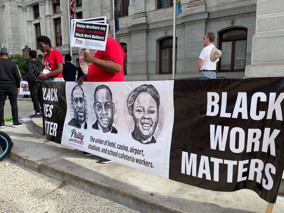 Activists at a vigil for George Floyd, two years after he was murdered by a now-fired Minneapolis police officer.