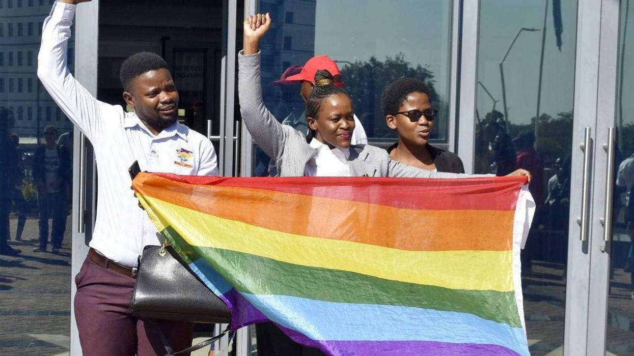 Activists celebrate outside the High Court in Gaborone, Botswana, Tuesday June 11, 2019.