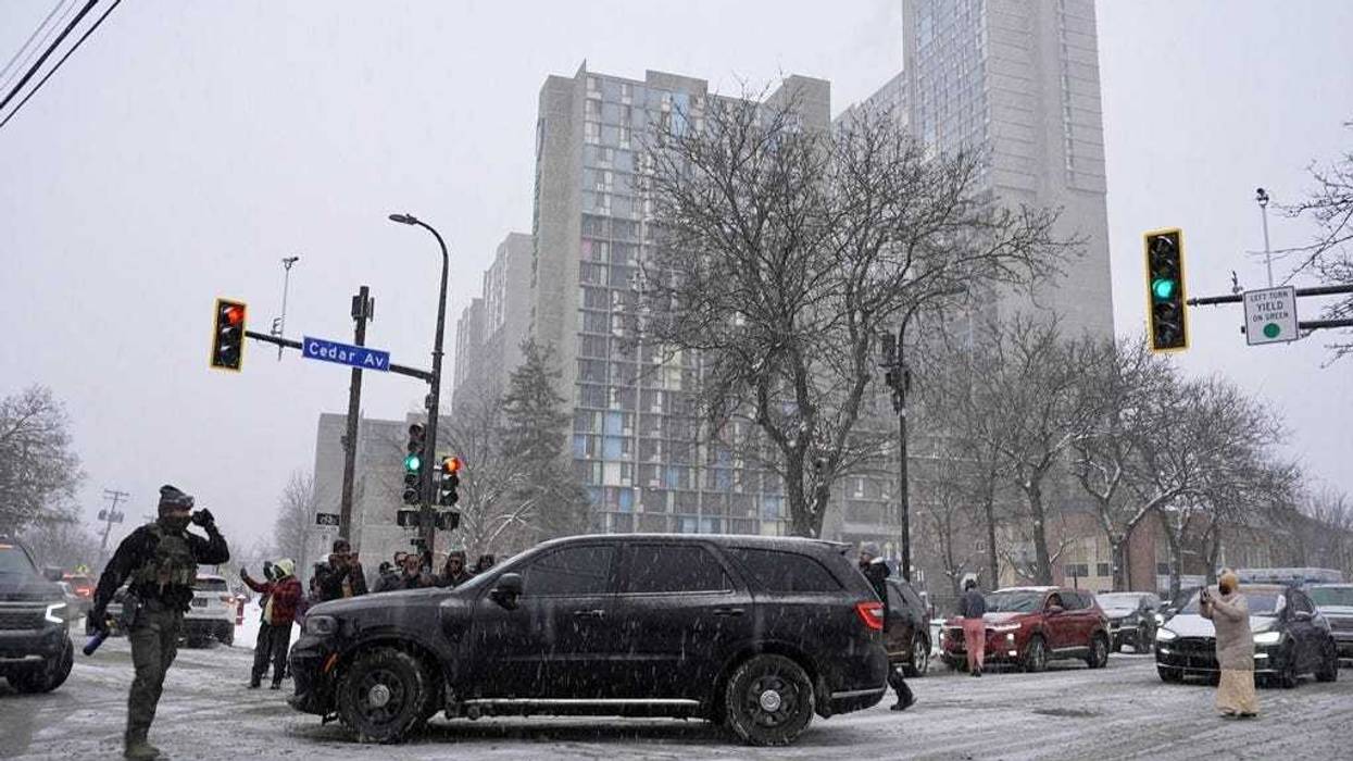 Activists confronted a group of Immigration and Customs Enforcement officers in the largely Somali neighborhood of Cedar-Riverside in Minneapolis, Tuesday, Dec. 9, 2025.
