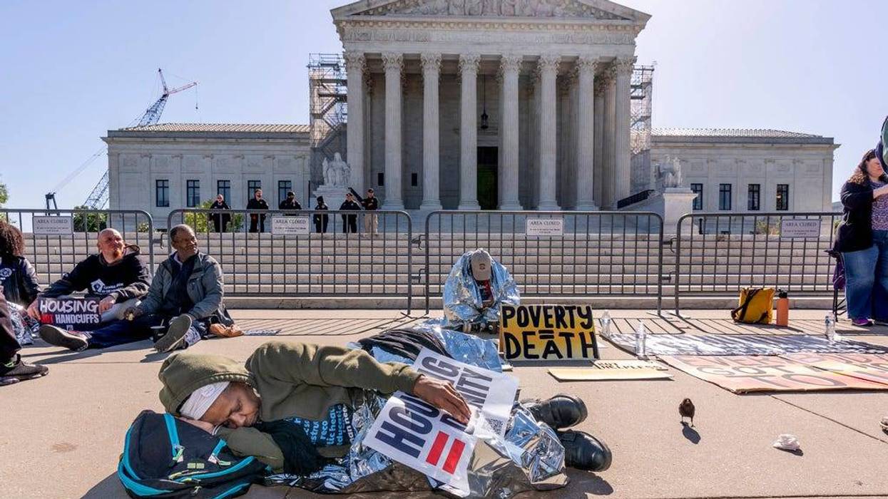 Activists demonstrate at the U.S. Supreme Court on Monday, April 22, as the justices consider a challenge to rulings that found punishing people for sleeping outside when shelter space is lacking amounts to unconstitutional cruel and unusual punishment.