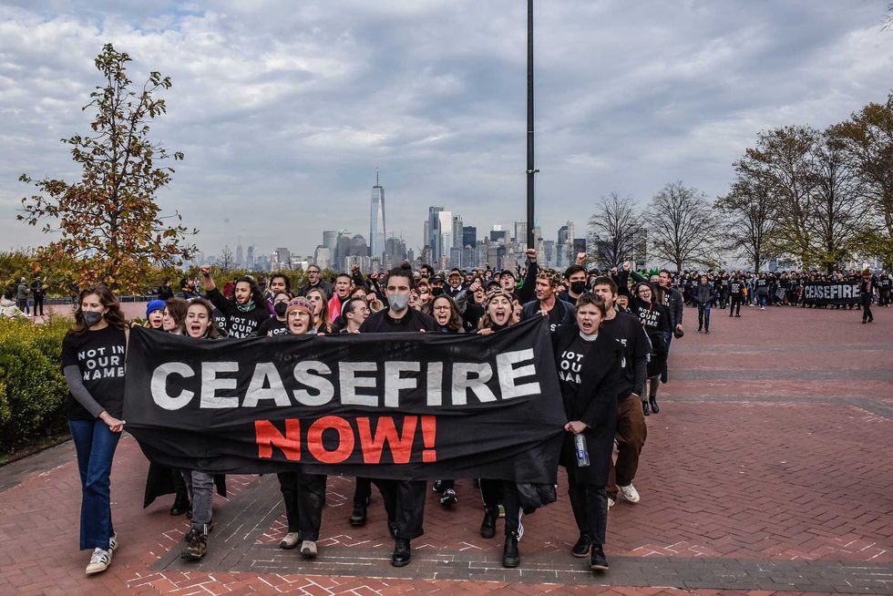 Activists from Jewish Voice for Peace return to the ferry after occupying the pedestal of the Statue of Liberty on November 6, 2023 in New York City. The group has been occupying high profile New York City locations calling for a ceasefire in Gaza.