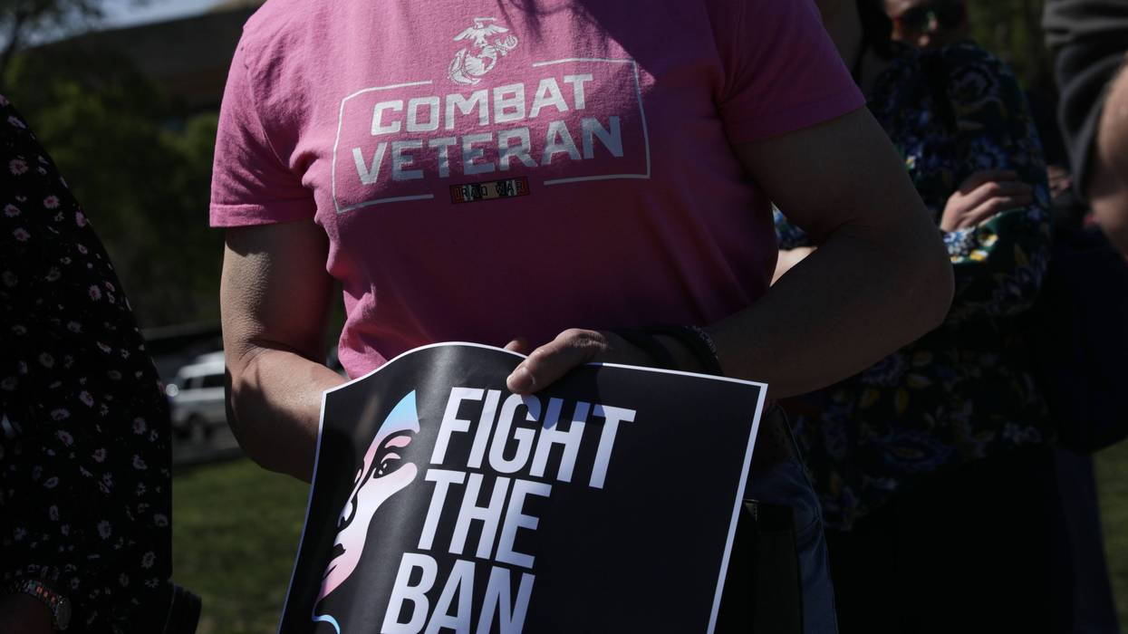 Activists participate in a rally at the Reflecting Pool of the U.S. Capitol April 10, 2019 in Washington, DC. Democratic lawmakers joined activists to rally against the transgender military service ban. (Photo by Alex Wong/Getty Images)