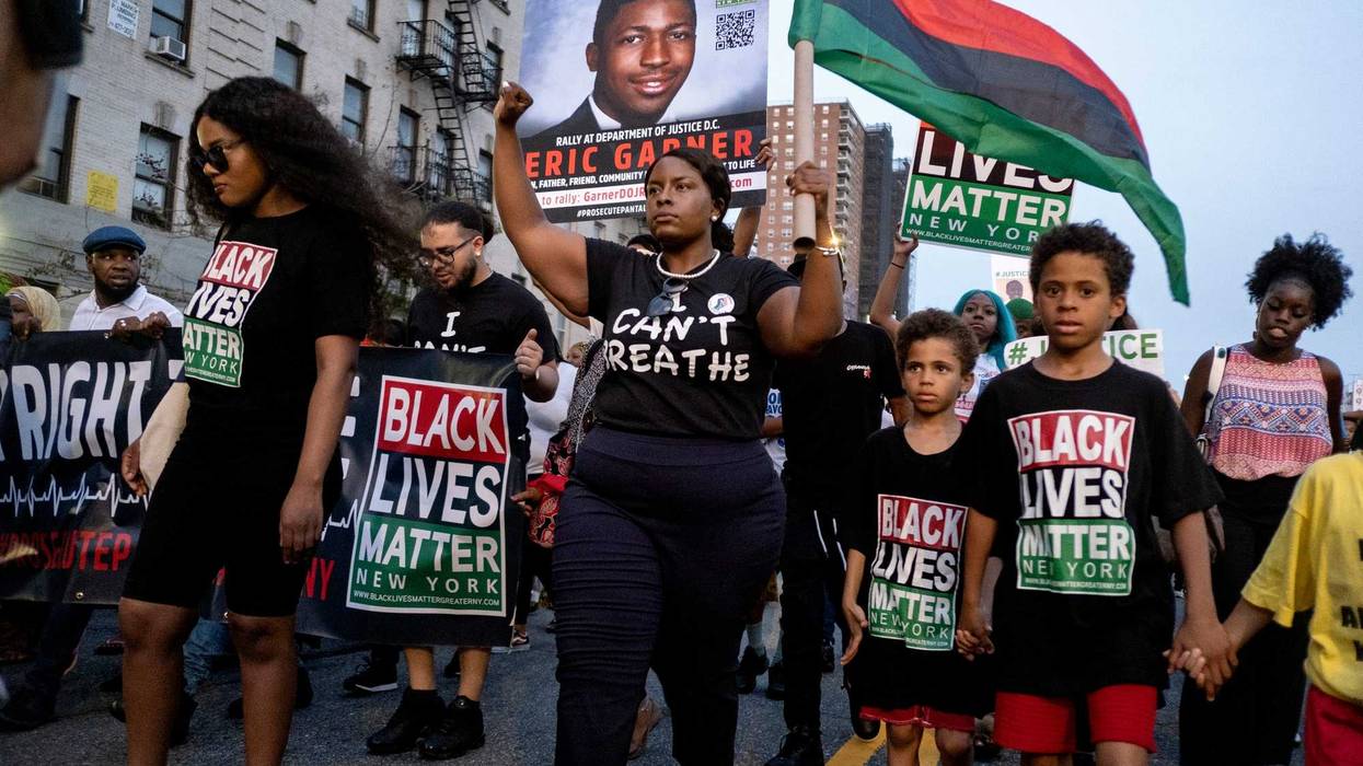 Activists with Black Lives Matter protest in the Harlem neighborhood of New York, Tuesday, July 16, 2019, in the wake of a decision by federal prosecutors who declined to bring civil rights charges against NYPD officer Daniel Pantaleo in the 2014 chokehold death of Eric Garne