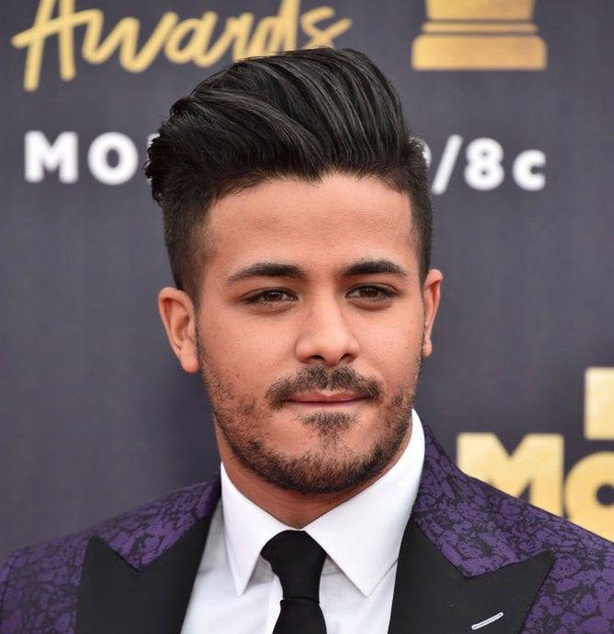 Actor Christian Navarro attends the 2018 MTV Movie And TV Awards at Barker Hangar on June 16, 2018 in Santa Monica, California.