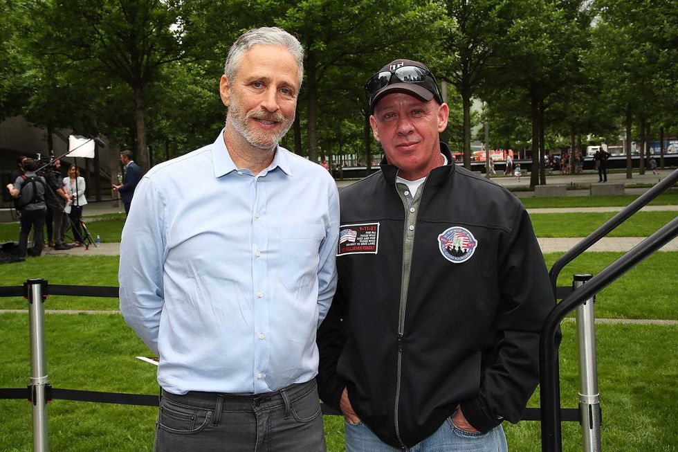 Actor/comedian Jon Stewart and founder of the FealGood Foundation, John Feal attend the design unveiling of 9/11 memorial to honor 9/11 rescue workers on May 30, 2018 in New York City.