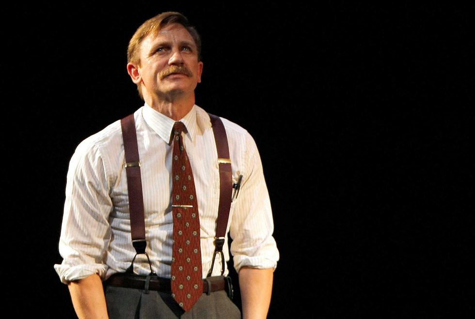 Actor Daniel Craig takes a bow during opening night curtain call for the broadway production of "A Steady Rain" at the Gerald Schoenfeld Theatre on September 29, 2009 in New York City. (Photo by Jemal Countess/Getty Images)
