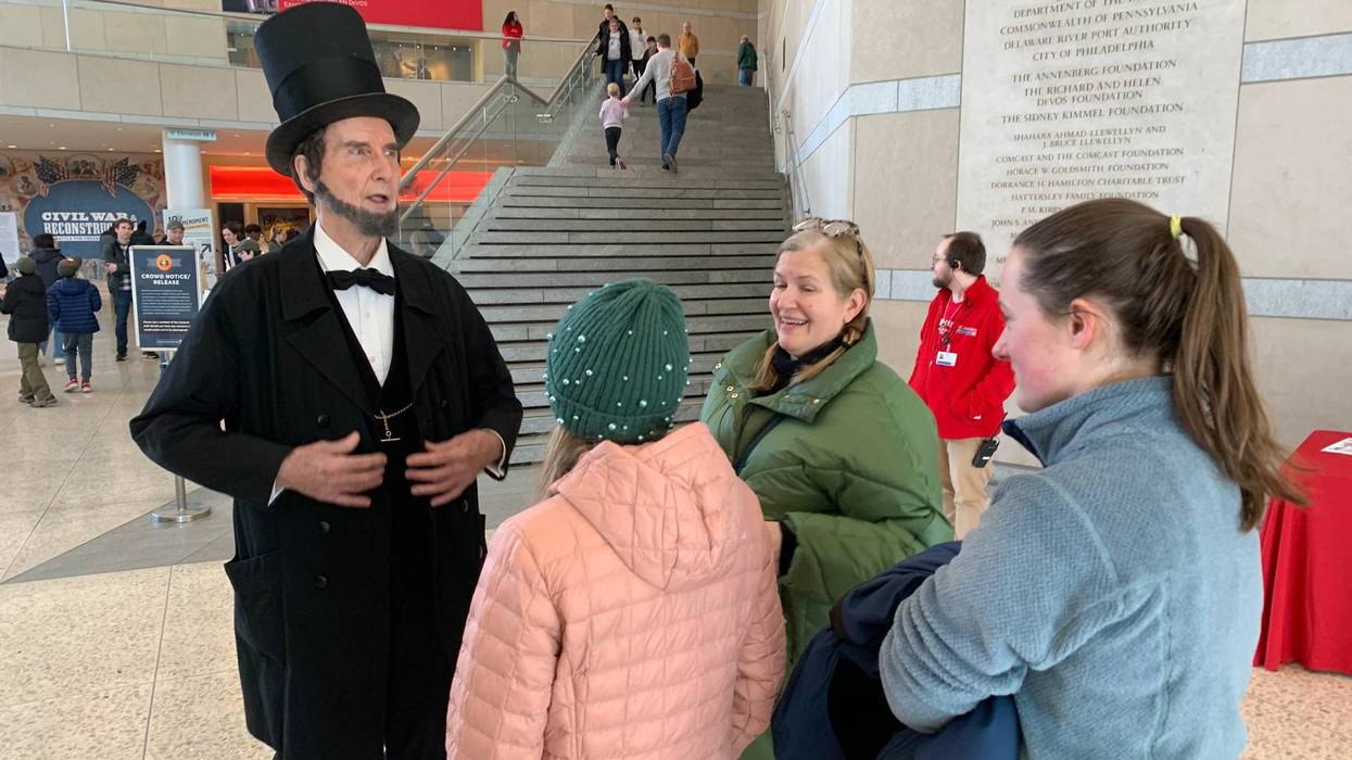 Actor portraying Abraham Lincoln greeted visitors at the Constitution Center’s free admission Monday