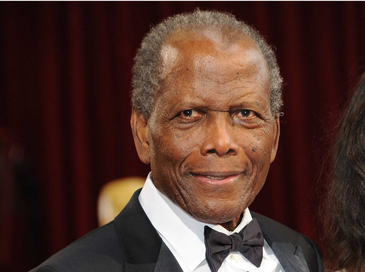 Actor Sidney Poitier arrives on the red carpet for the 86th Academy Awards on March 2nd, 2014 in Hollywood, California.