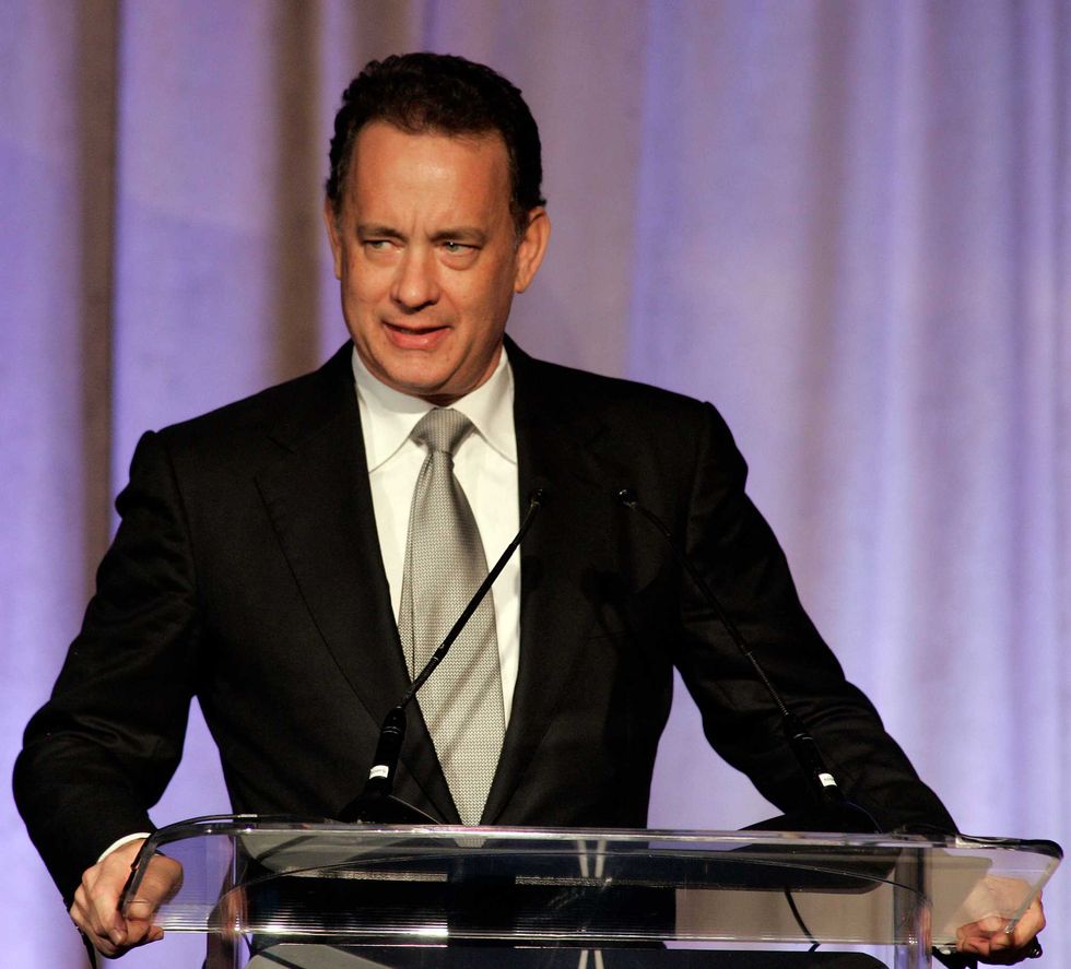 Actor Tom Hanks pauses as he introduces Captain James A. Lovell Jr. who is receiving the Lincoln Leadership prize during a dinner honoring contemporary world leaders February 11, 2010 in Chicago, Illinois. Lovell is celebrating the 40th anniversary of piloting the Apollo 13 mission.