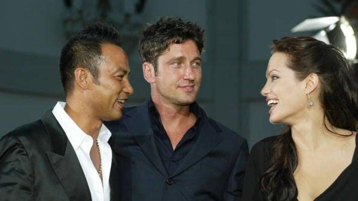 Actors Simon Yam, Gerard Butler and Angelina Jolie attend the world premiere of the film "Lara Croft Tomb Raider: The Cradle of Life" at Grauman's Chinese Theatre July 21, 2003 in Hollywood, California. The film releases nationwide July 25, 2003.