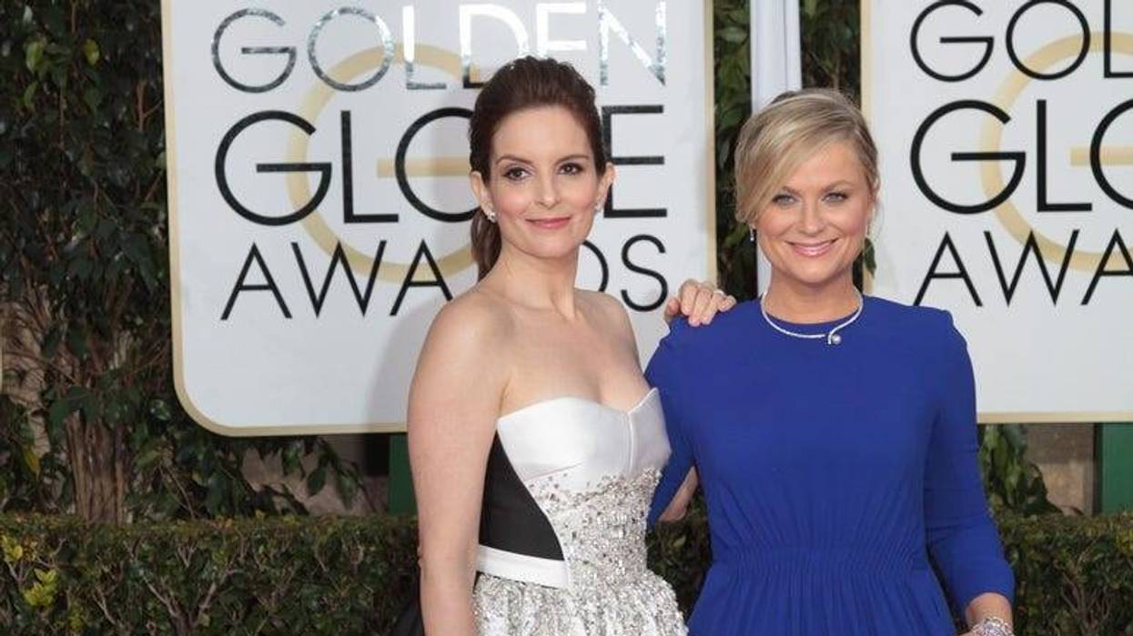 Actress and Co-Host Tina Fey and Amy Poehler arrive at the 72nd Annual Golden Globe Awards