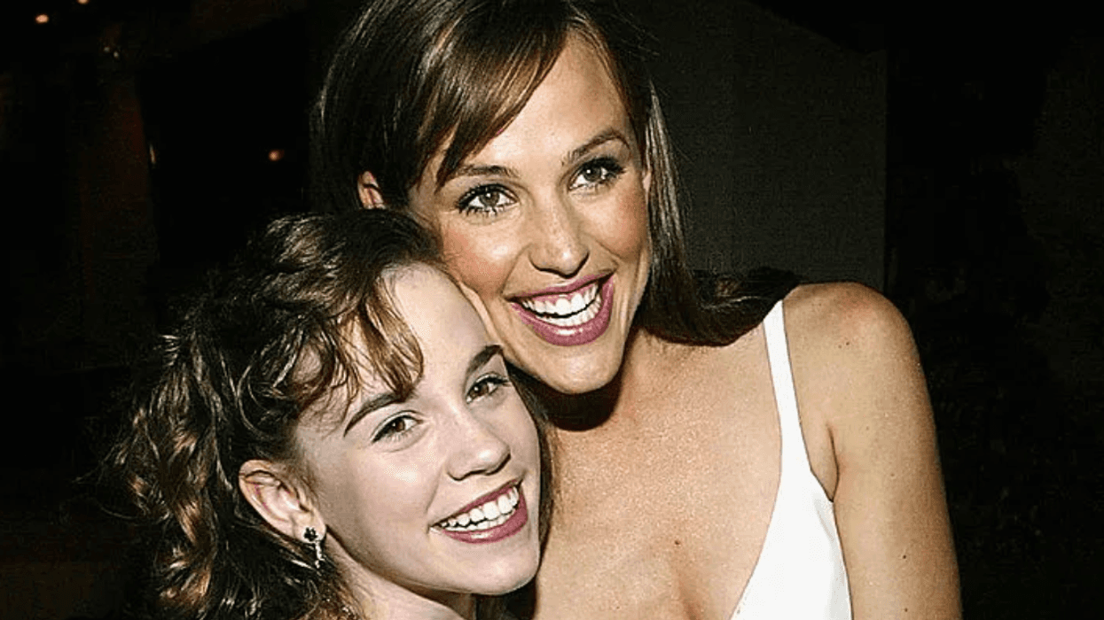 Actress Christa Allen (L) and actress Jennifer Garner hug at the after party for the film "13 going on 30" following the premiere of the film April 14, 2004 in Westwood, California. (Photo by Carlo Allegri/Getty Images)