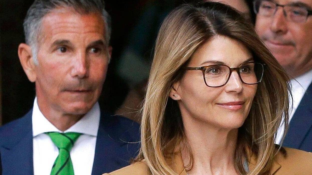 actress Lori Loughlin, front, and husband, clothing designer Mossimo Giannulli, left, depart federal court in Boston after facing charges in a nationwide college admissions bribery scandal. The famous couple pleaded guilty to charges in May 2020, and are