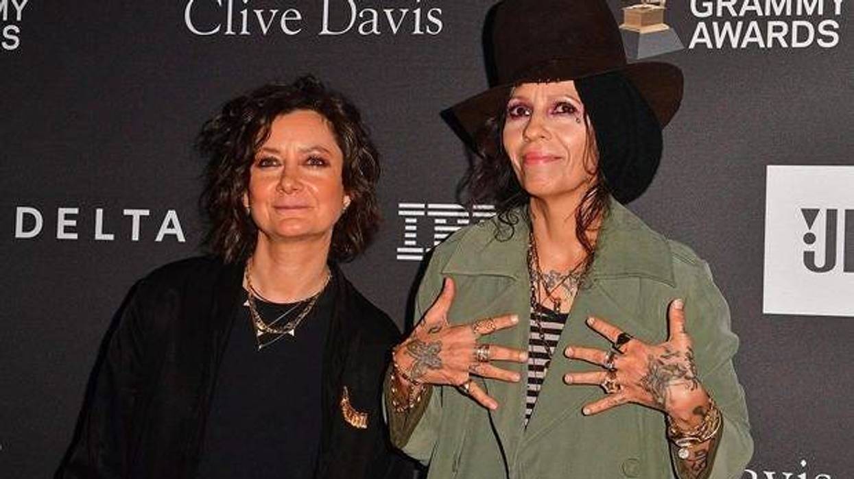 Actress Sara Gilbert (L) and singer-songwriter Linda Perry arrive for the traditional Clive Davis party on the eve of the 61th Annual Grammy Awards on February 9, 2019.