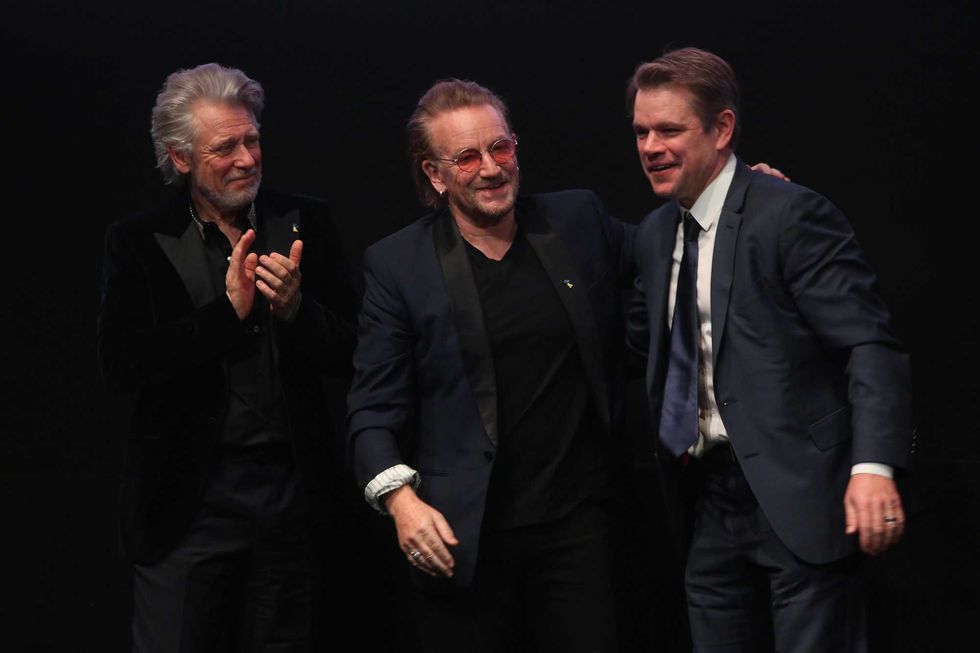 Adam Clayton (L) and Bono (C) from the band U2, and Matt Damon attend the "Kiss The Future" documentary film premiere during the 73rd Berlinale International Film Festival Berlin at Verti Music Hall on February 19, 2023 in Berlin, Germany.