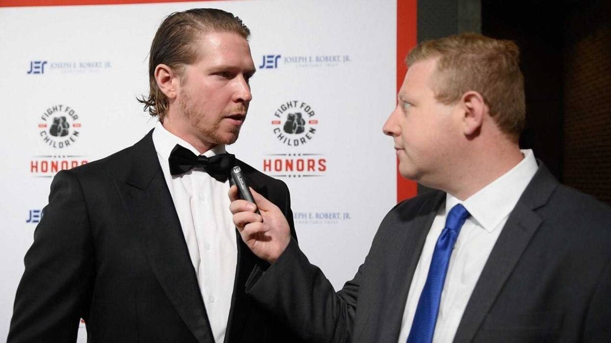 Adam Epstein talks with Washington Capitals center Nicklas Backstrom at the Fight for Children event on May 4, 2023.