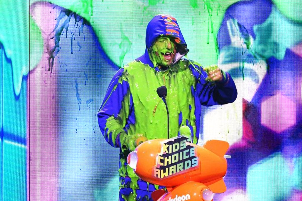 Adam Sandler gets slimed with the Favorite Male Voice from an Animated Movie award for 'Hotel Transylvania 3: Summer Vacation' onstage at Nickelodeon's 2019 Kids' Choice Awards at Galen Center on March 23, 2019 in Los Angeles, California
