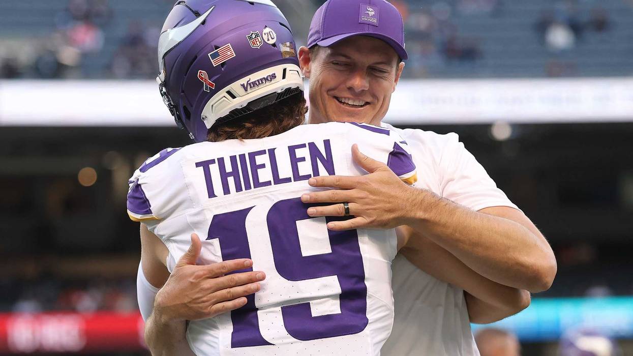 Adam Thielen #19 of the Minnesota Vikings hugs head coach Kevin O'Connell prior to the game against the Chicago Bears at Soldier Field on September 08, 2025 in Chicago, Illinois.