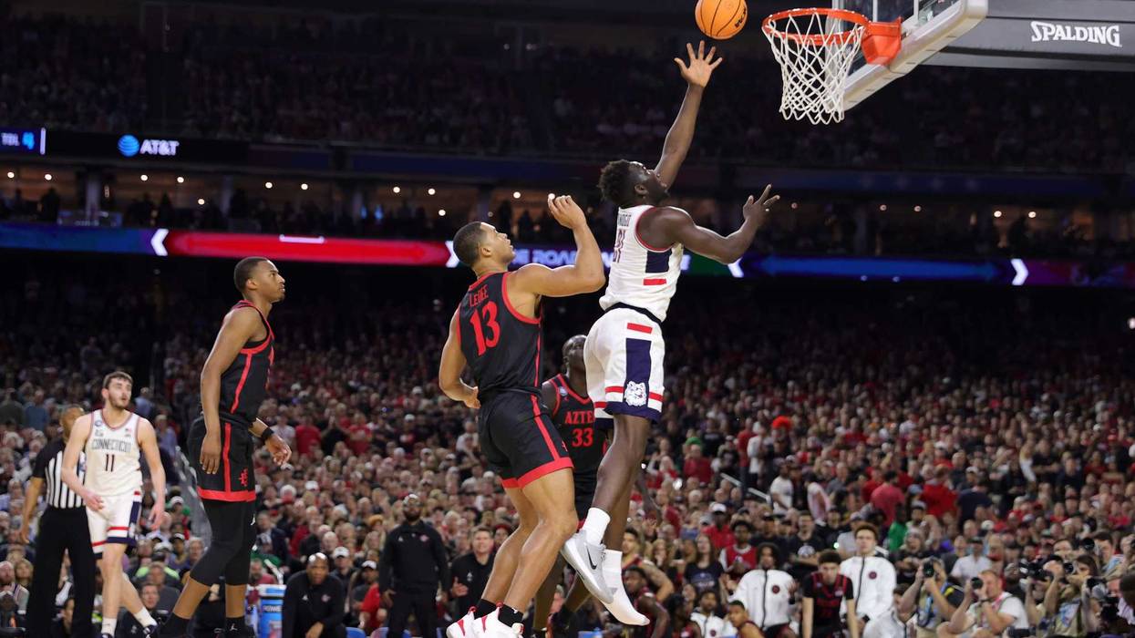 Adama Sanogo of UConn shoots the ball against the San Diego State Aztecs during the first half during the NCAA Men's Basketball Tournament National Championship in Houston, 4/3/23
