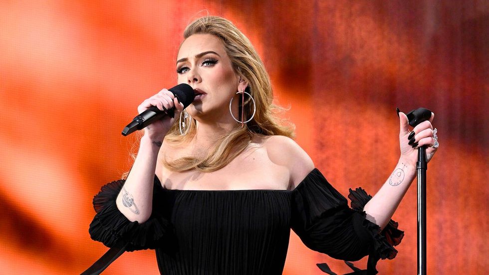Adele weighs in on fans throwing things on stage: 'I f***ing dare you'