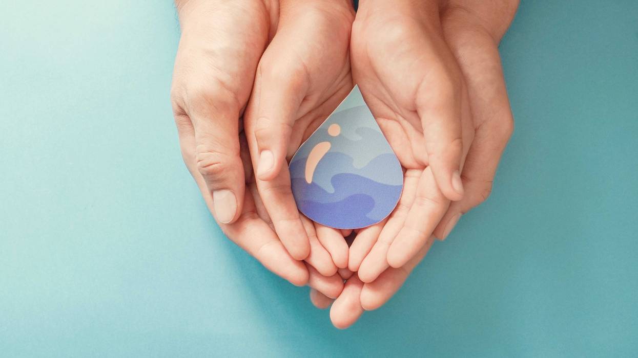 Adult and child hands holding paper cut water drop, World Water Day, Clean water and sanitation, CSR, save water, ecology concept