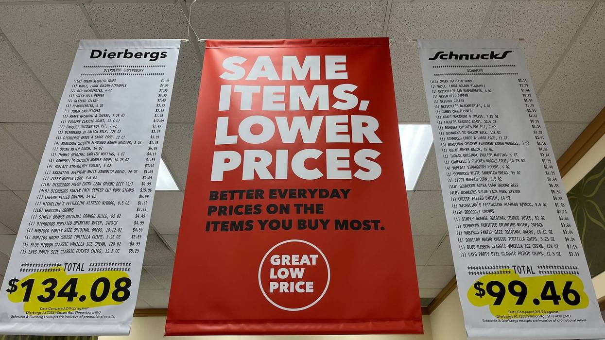 Advertising banners made to look like receipts hang inside the Schnucks store at Hampton and Gravois.