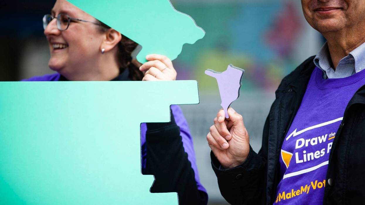 Advocates for an independent redistricting process hold a rally at the Pennsylvania Capitol in Harrisburg.