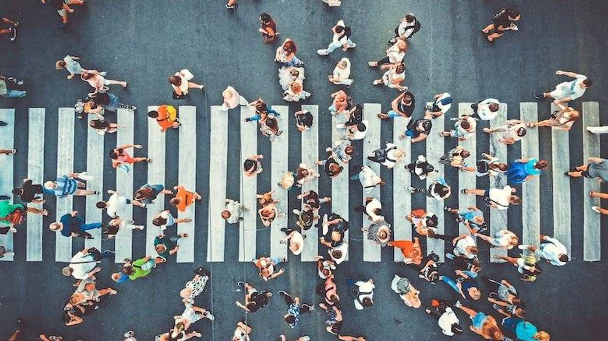 Aerial view of people walking on a sidewalk