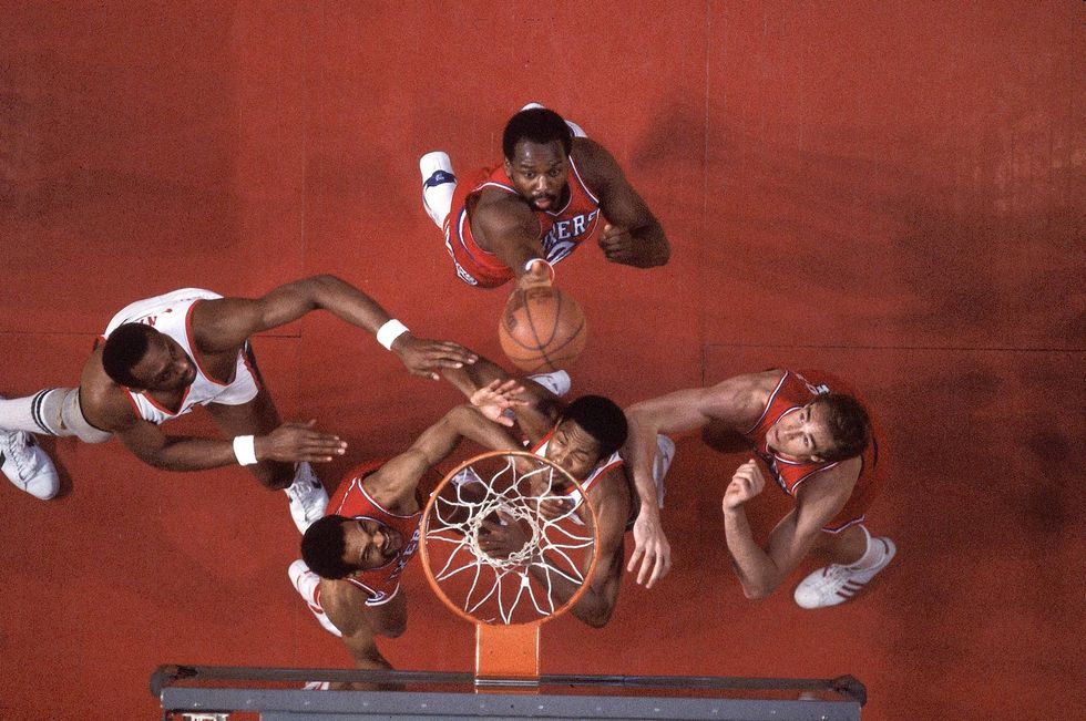 Aerial view of Philadelphia 76ers Moses Malone (2) in action vs Milwaukee Bucks Bob Lanier (16) at Milwaukee Arena. Game 3.