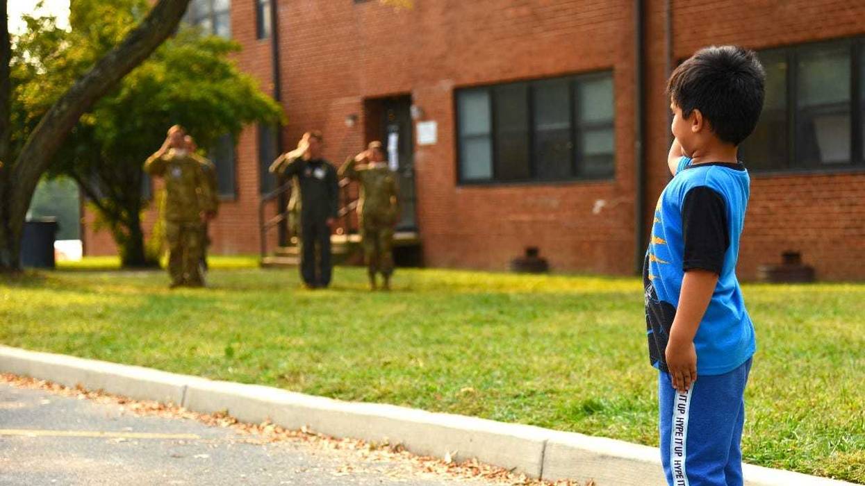 Afghan child salutes