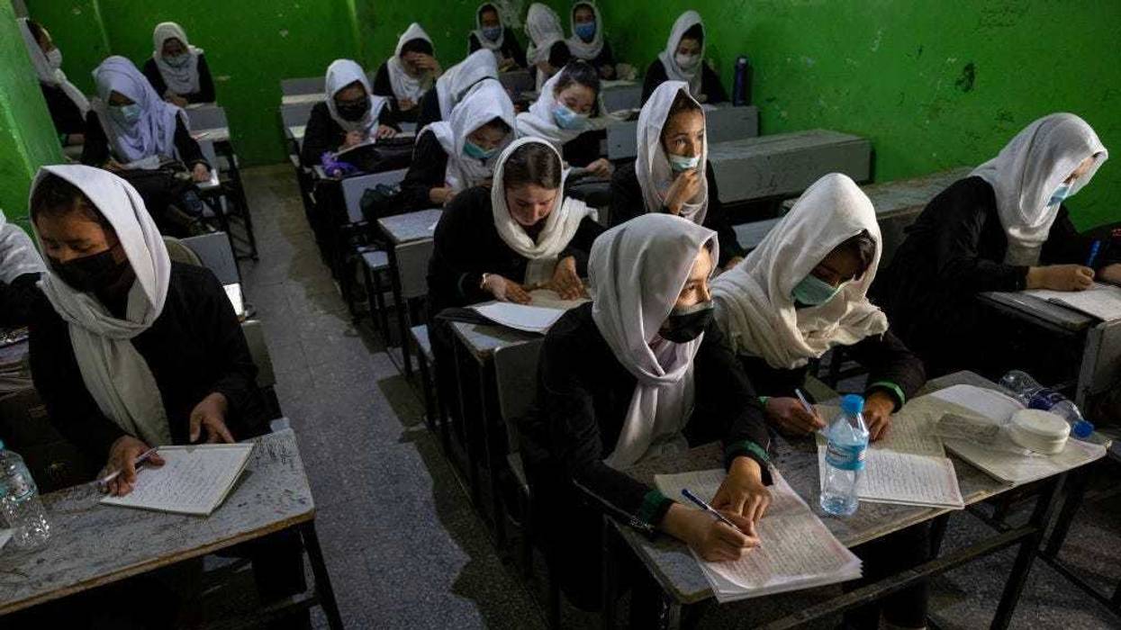 Afghan female students listen during 10th grade class at the Zarghoona high school on July 25 2021 in Kabul, Afghanistan.