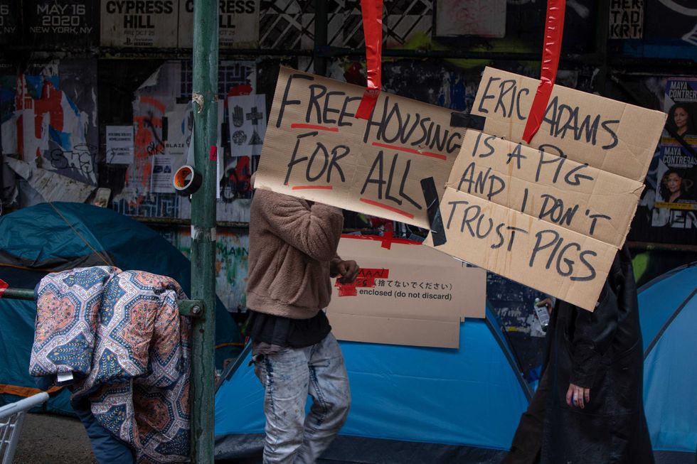 After receiving a notice from the city Department of Sanitation, a homeless encampment and its supporters prepare for a police sweep in which their possessions will be thrown away, May 4, 2022 in the East Village neighborhood of New York City.