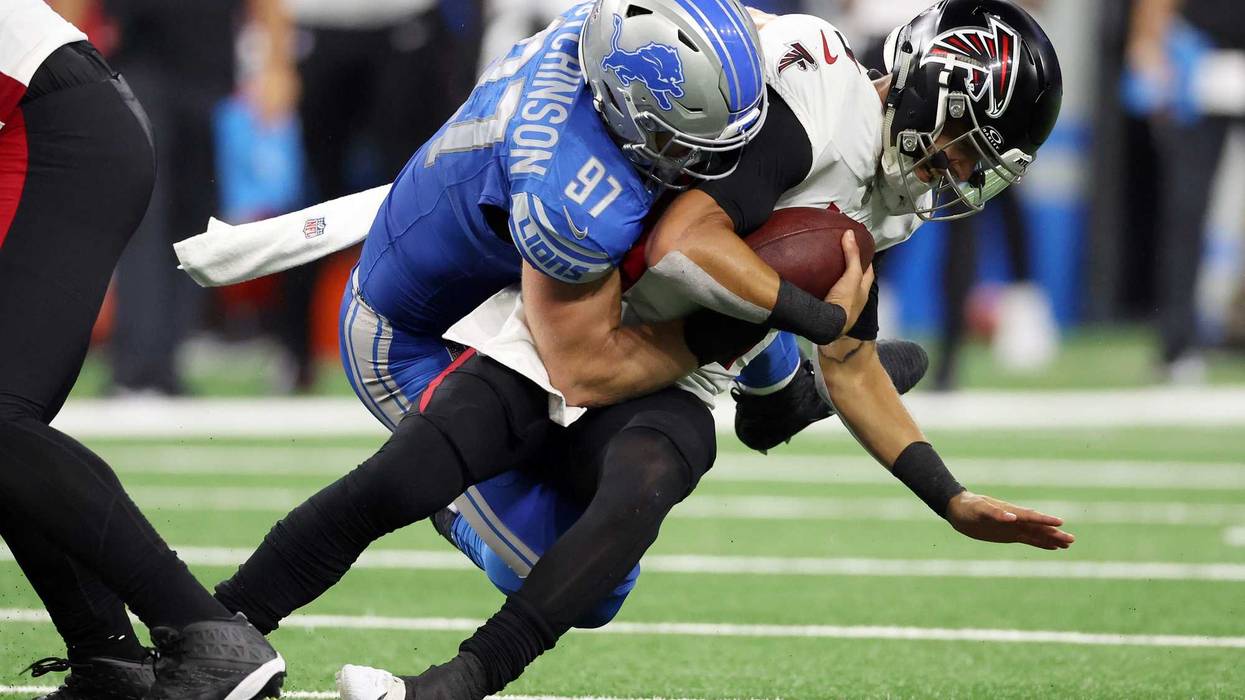 Aidan Hutchinson #97 of the Detroit Lions sacks Desmond Ridder #9 of the Atlanta Falcons in the fourth quarter at Ford Field