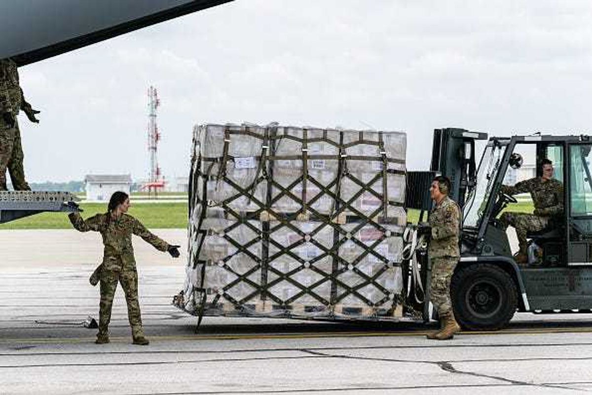 Airmen unload pallets from the cargo bay of a U.S. Air Force C-17 carrying 78,000 lbs of Nestlé Health Science Alfamino Infant and Alfamino Junior formula from Europe at Indianapolis Airport on May 22, 2022 in Indianapolis, Indiana. The mission, known as Operation Fly Formula, is being executed to address an infant formula shortage caused by the closure of the United States largest formula manufacturing plant due to safety and contamination issues.