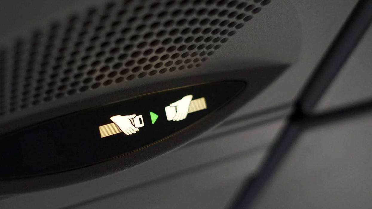 Airplane seatbelt sign stock photo.