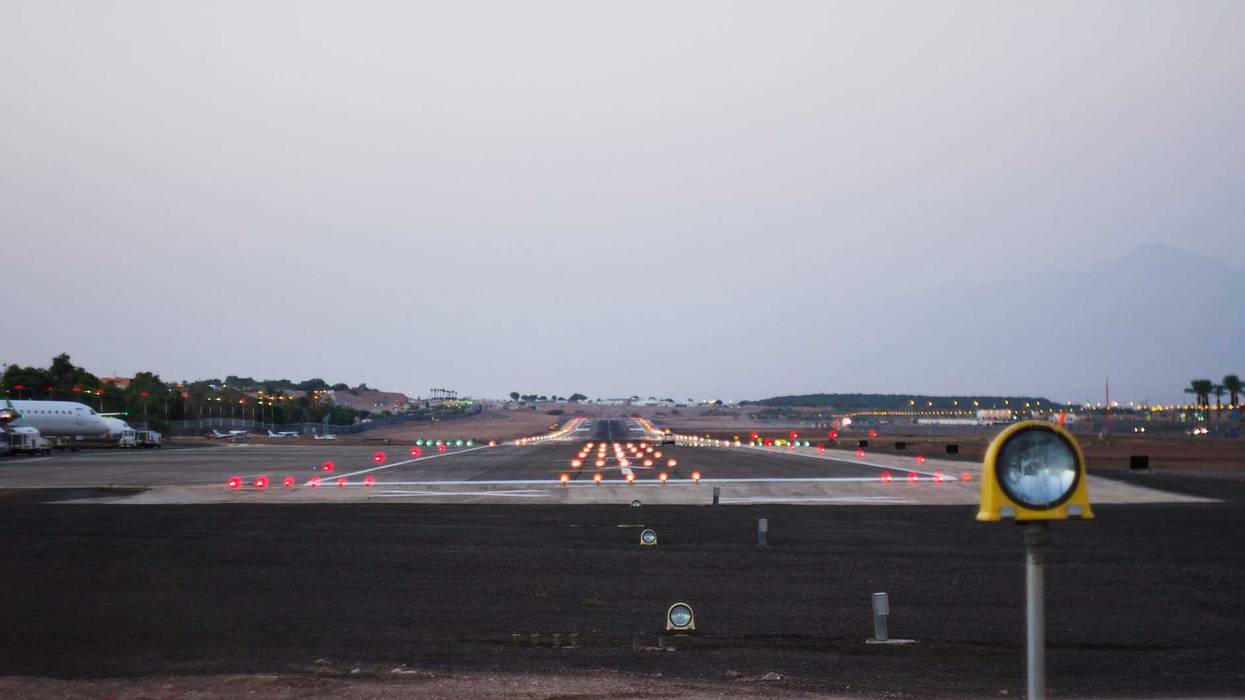 Airport runway at dusk.
